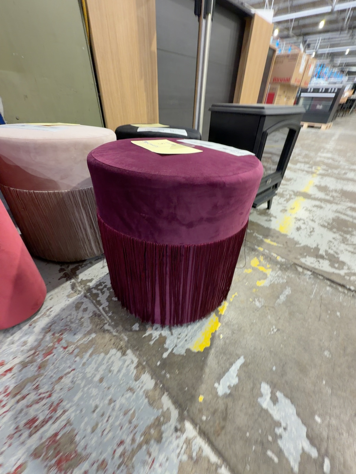 EX HIRE - PLUM VELVET ROUND OTTOMAN WITH TASSLES, SOLD AS IS