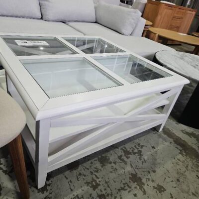 EX DISPLAY HOME STAGING FURNITURE - HAMPTON STYLE 1000MM SQUARE WHITE TIMBER COFFEE TALBE, GLASS WITH OPEN DISPLAY SHELVES BELOW, SOLD AS IS EX DISPLAY HOME STAGING FURNITURE - HAMPTON STYLE 1000MM SQUARE WHITE TIMBER COFFEE TALBE, GLASS WITH OPEN DISPLAY SHELVES BELOW, SOLD AS IS