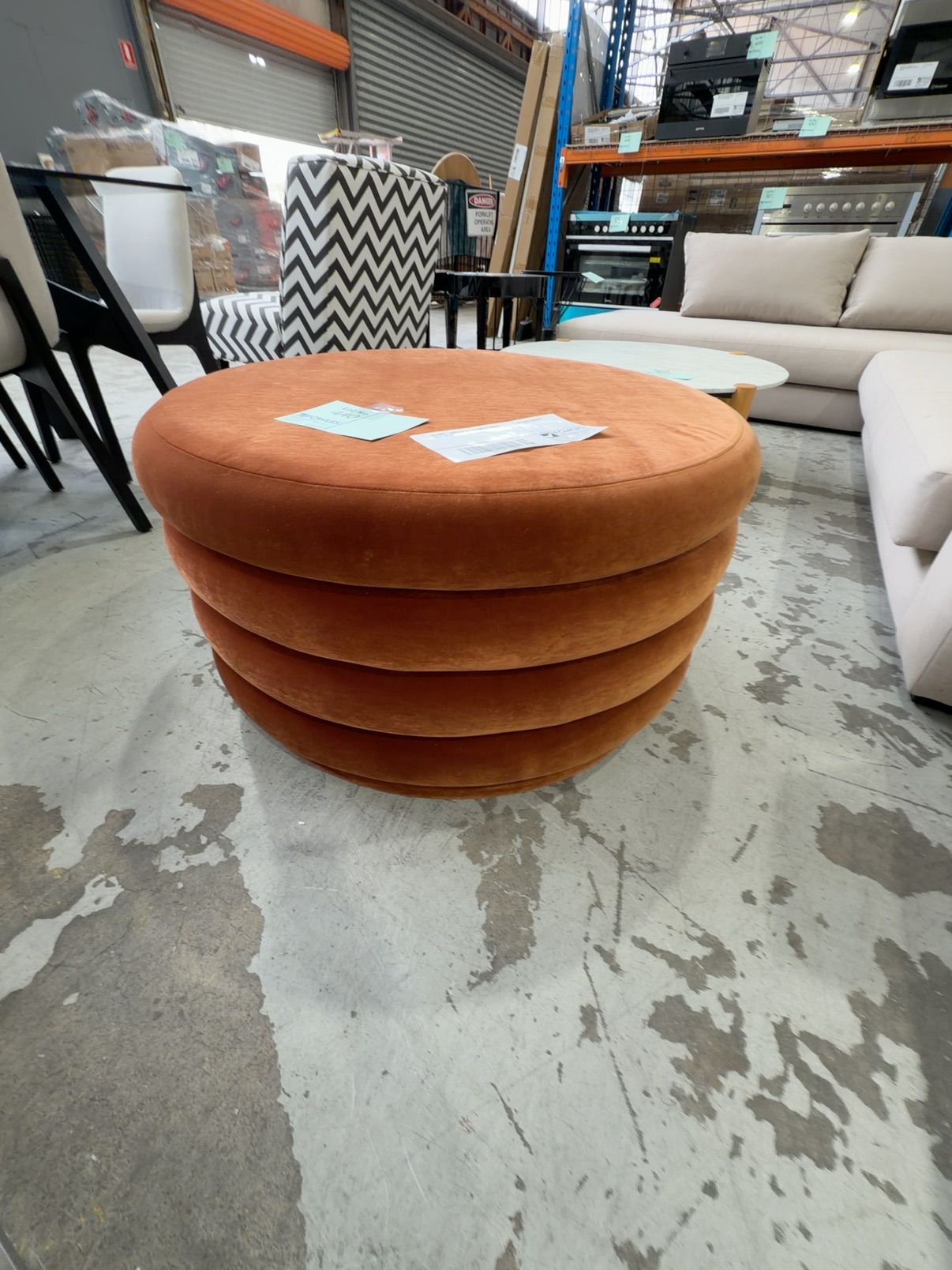 EX HIRE - RUST VELVET ROUND OTTOMAN, SOLD AS IS EX HIRE - RUST VELVET ROUND OTTOMAN, SOLD AS IS