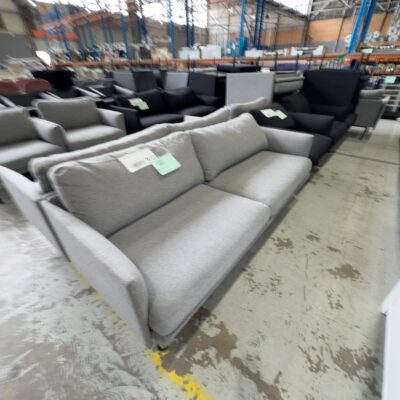 EX HIRE - GREY MATERIAL COUCH, SOLD AS IS EX HIRE - GREY MATERIAL COUCH, SOLD AS IS