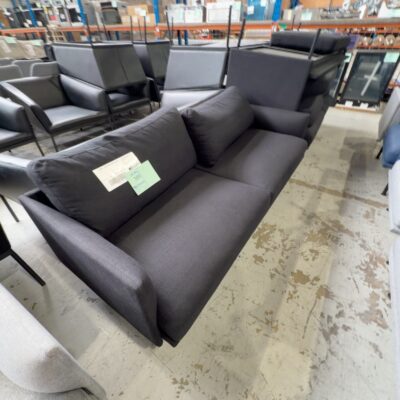 EX HIRE - BLACK MATERIAL COUCH, SOLD AS IS EX HIRE - BLACK MATERIAL COUCH, SOLD AS IS