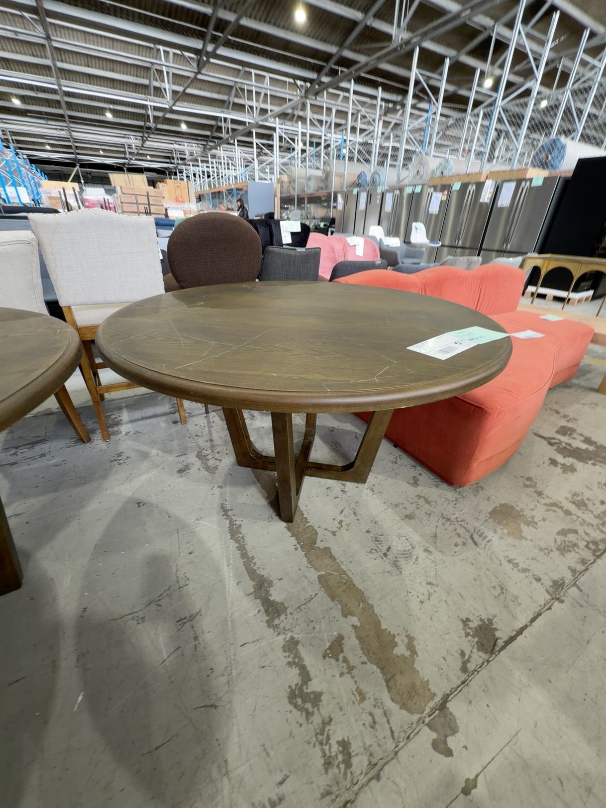 EX STAGING - 1300MM ROUND OAK DINING TABLE, DARK STAIN, SOLD AS IS **SOME MARKS IN TOP** EX STAGING - 1300MM ROUND OAK DINING TABLE, DARK STAIN, SOLD AS IS **SOME MARKS IN TOP**