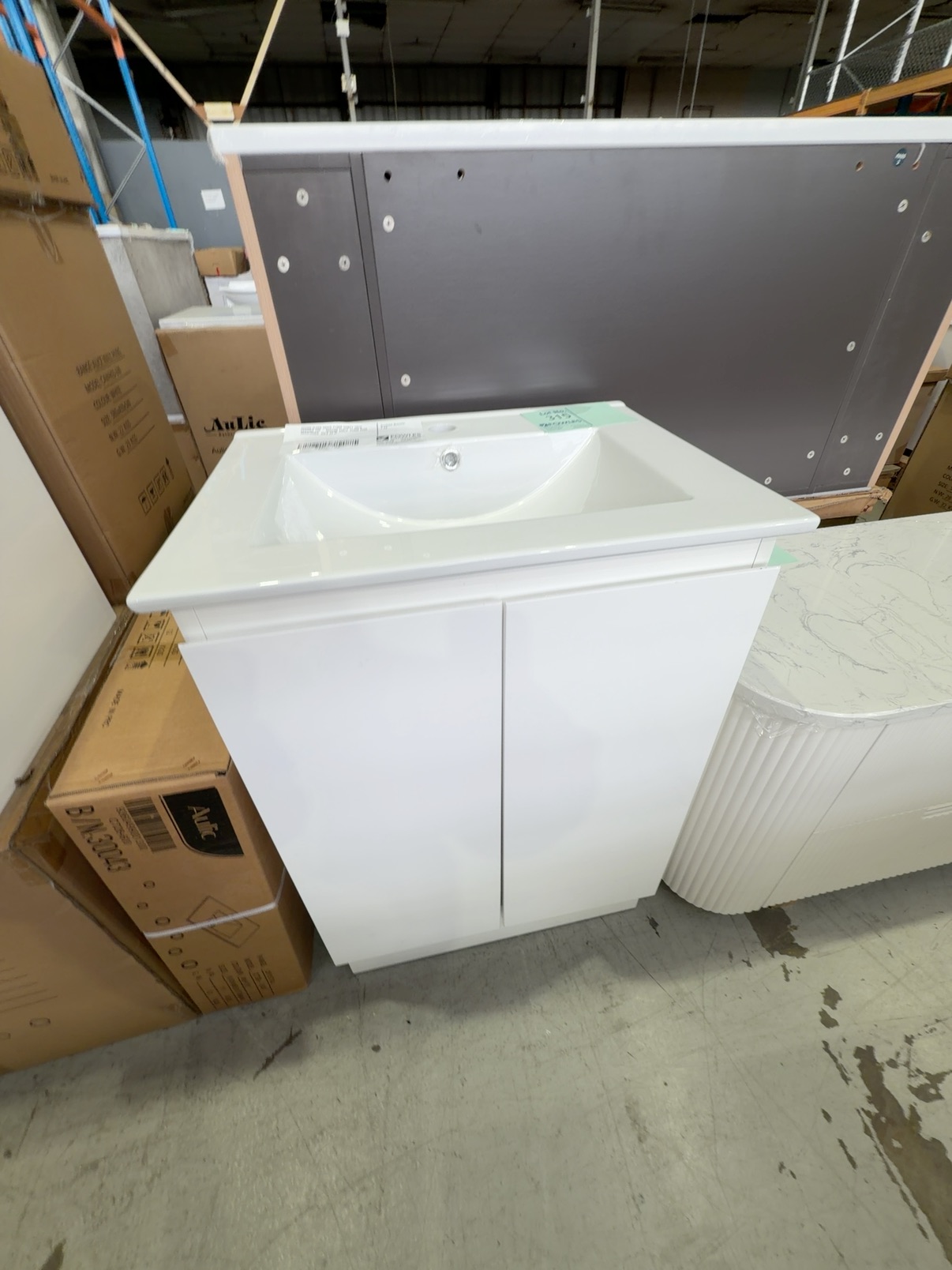 600MM GLOSS WHITE FLOOR VANITY WITH CERAMIC TOP - MISSING SHELF, FLOOR BASE MISALIGNED, SOLD AS IS 600MM GLOSS WHITE FLOOR VANITY WITH CERAMIC TOP - MISSING SHELF, FLOOR BASE MISALIGNED, SOLD AS IS