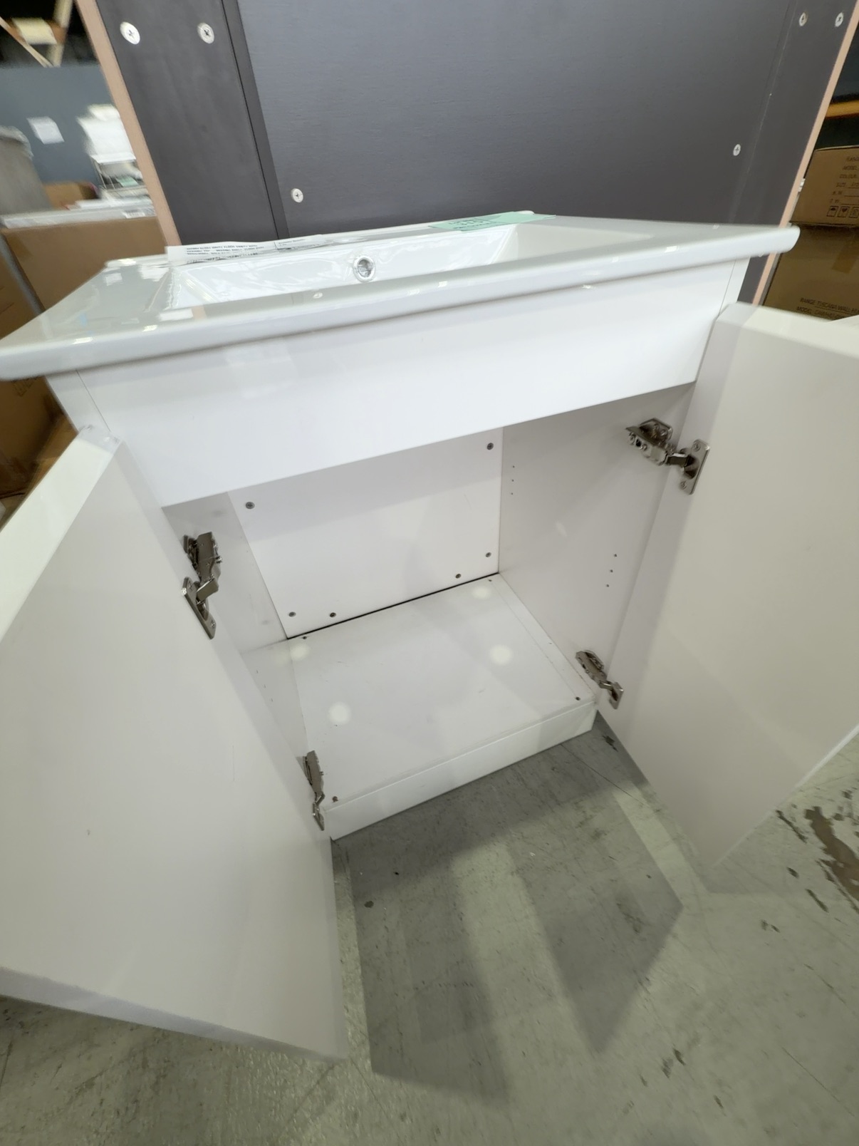 600MM GLOSS WHITE FLOOR VANITY WITH CERAMIC TOP - MISSING SHELF, FLOOR BASE MISALIGNED, SOLD AS IS 600MM GLOSS WHITE FLOOR VANITY WITH CERAMIC TOP - MISSING SHELF, FLOOR BASE MISALIGNED, SOLD AS IS