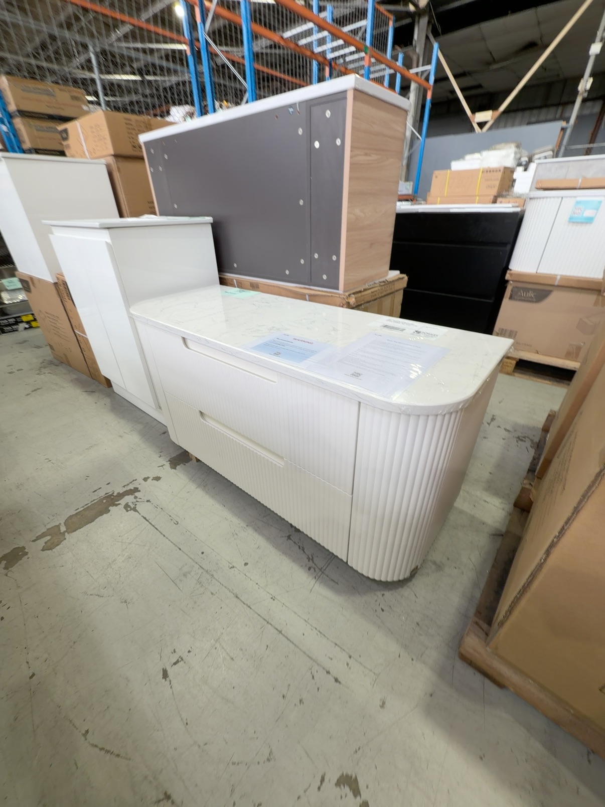 NEW AULIC CURVA 1200MM WALL HUNG VANITY, CURVED MATTE WHITE FLUTED PROFILE, 2 DRAWERS, WITH CATO FLAT STONE TOP RRP$3155 CAWH46-1200-ST26FT NEW AULIC CURVA 1200MM WALL HUNG VANITY, CURVED MATTE WHITE FLUTED PROFILE, 2 DRAWERS, WITH CATO FLAT STONE TOP RRP$3155 CAWH46-1200-ST26FT
