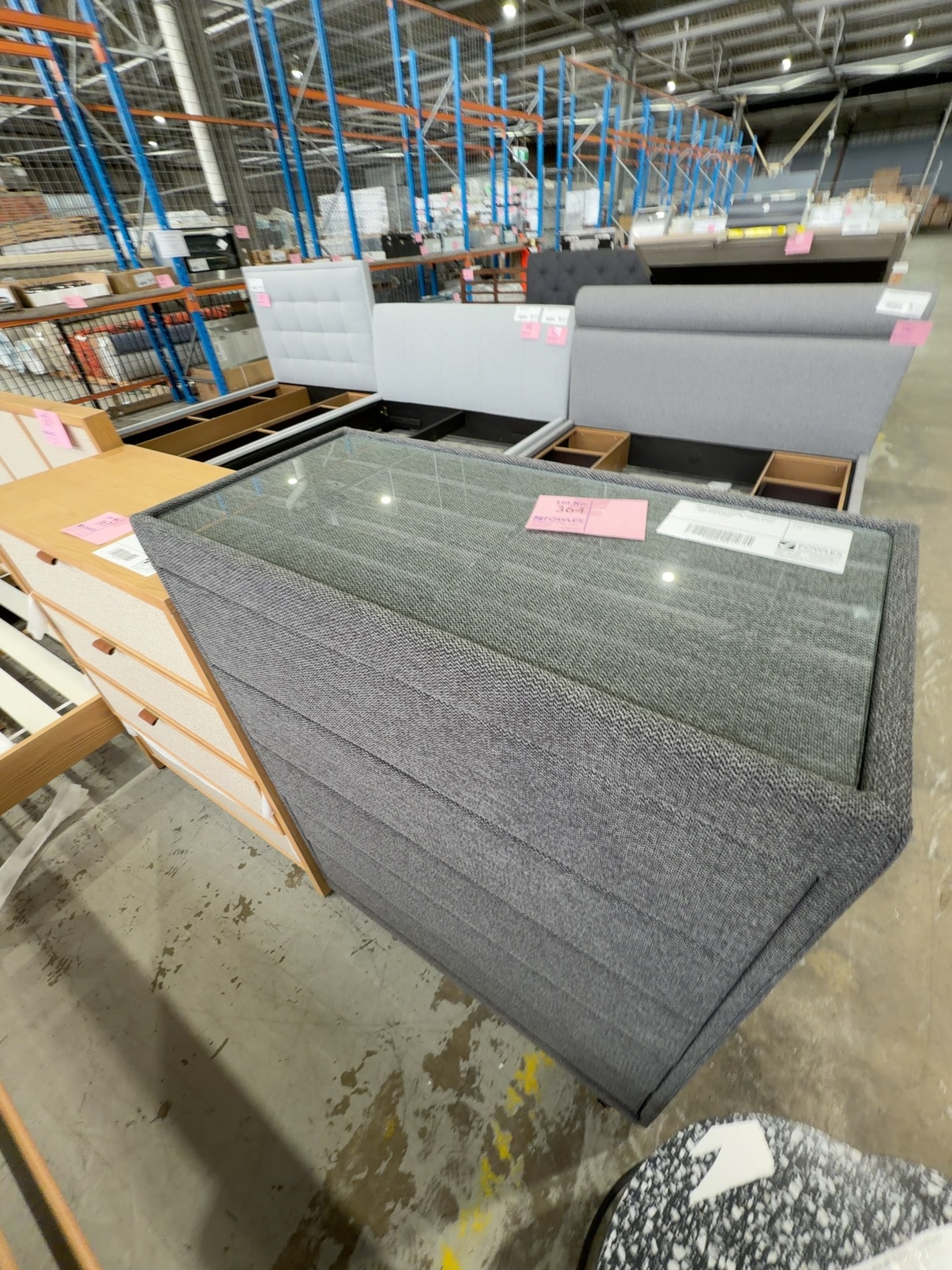 NEW ELEVATION 5 DRAWER TALLBOY, PEPPER FABRIC, GLASS TOP GGF1605 **CRACK IN FEET - WILL NEED REPAIR** NEW ELEVATION 5 DRAWER TALLBOY, PEPPER FABRIC, GLASS TOP GGF1605 **CRACK IN FEET - WILL NEED REPAIR**