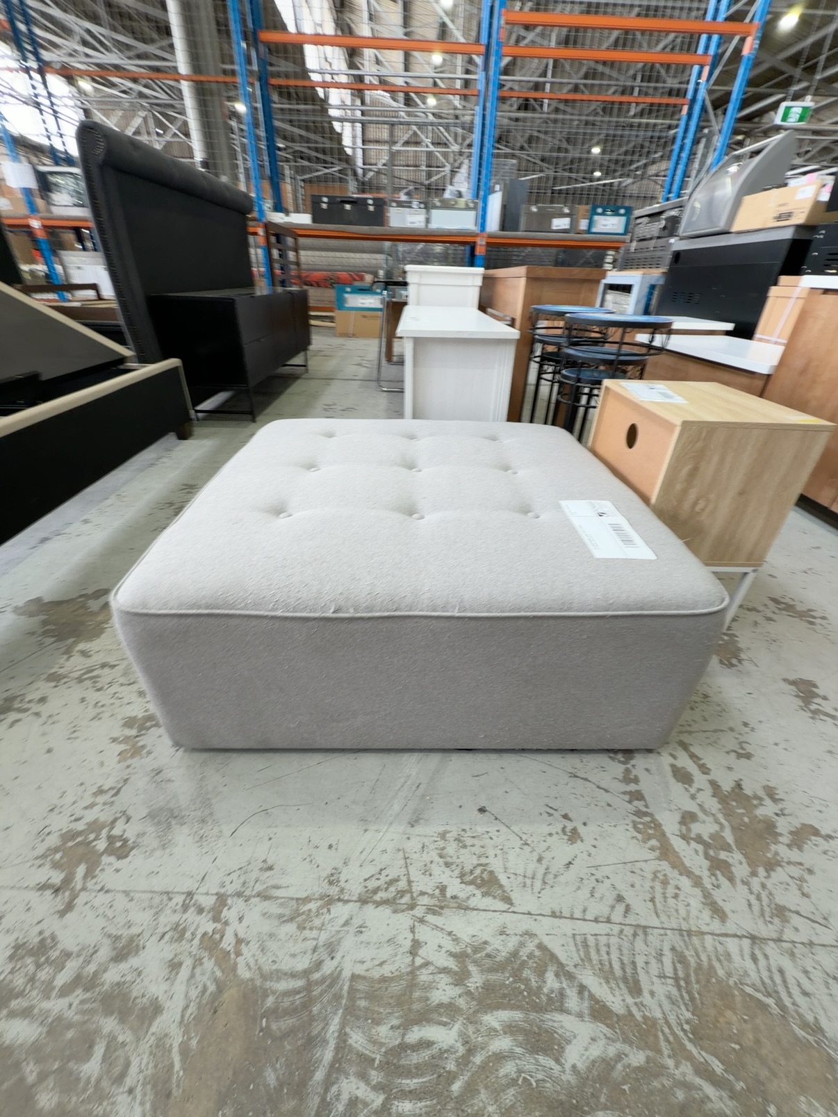 EX SHOWROOM, LARGE GREY FABRIC OTTOMAN, SOLD AS IS EX SHOWROOM, LARGE GREY FABRIC OTTOMAN, SOLD AS IS