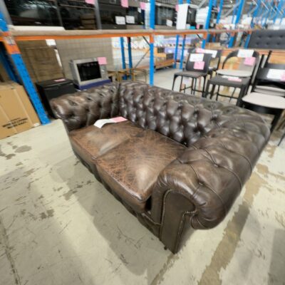 EX SHOWROOM, LEATHER CHESTERFIELD STYLE 2 SEATER COUCH SOLD AS IS