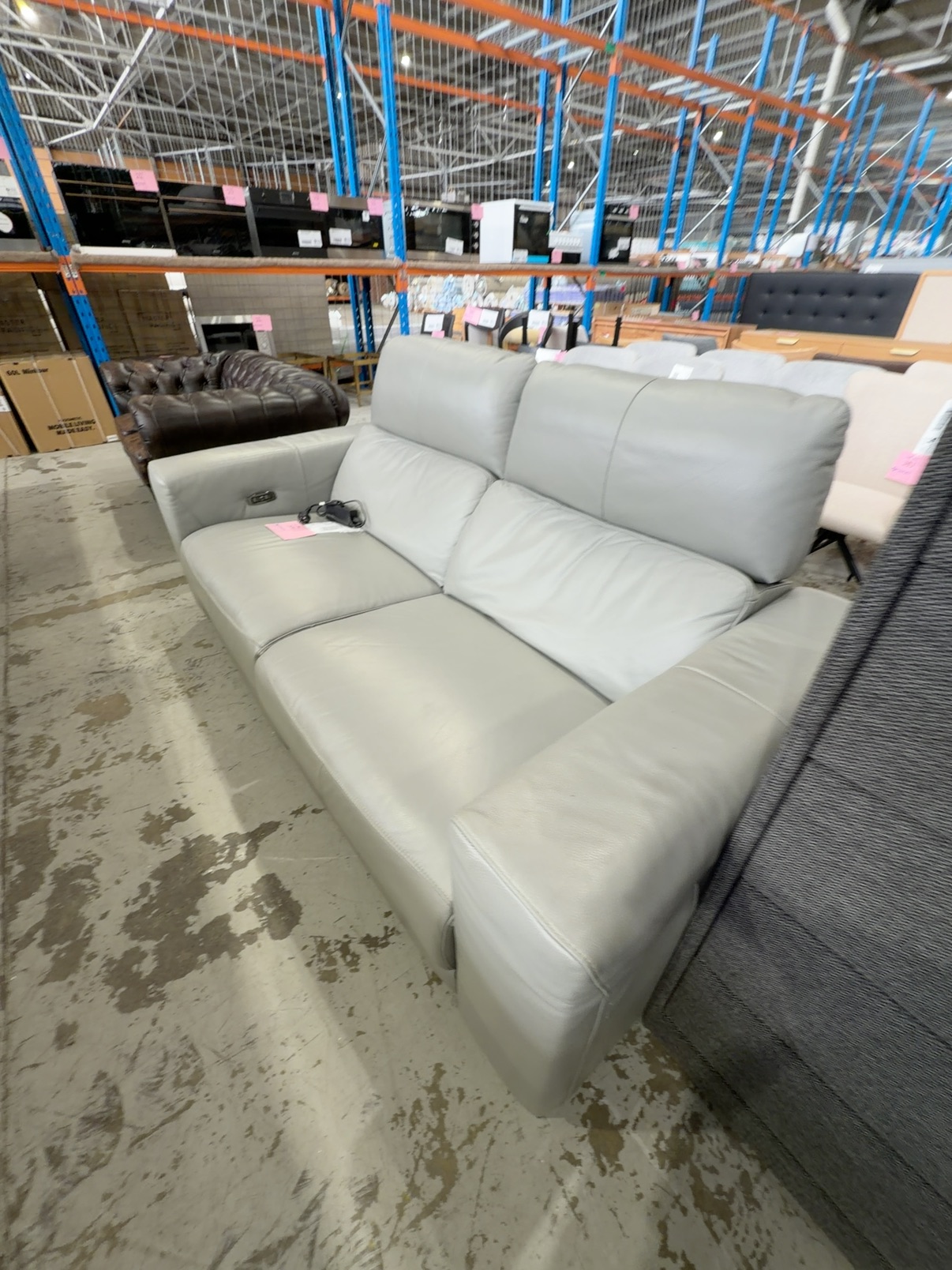 SECOND HAND - GREY LEATHER 2.5 SEATER COUCH, ELECTRIC RECLINER & HEADRESTSOLD AS IS SECOND HAND - GREY LEATHER 2.5 SEATER COUCH, ELECTRIC RECLINER & HEADRESTSOLD AS IS