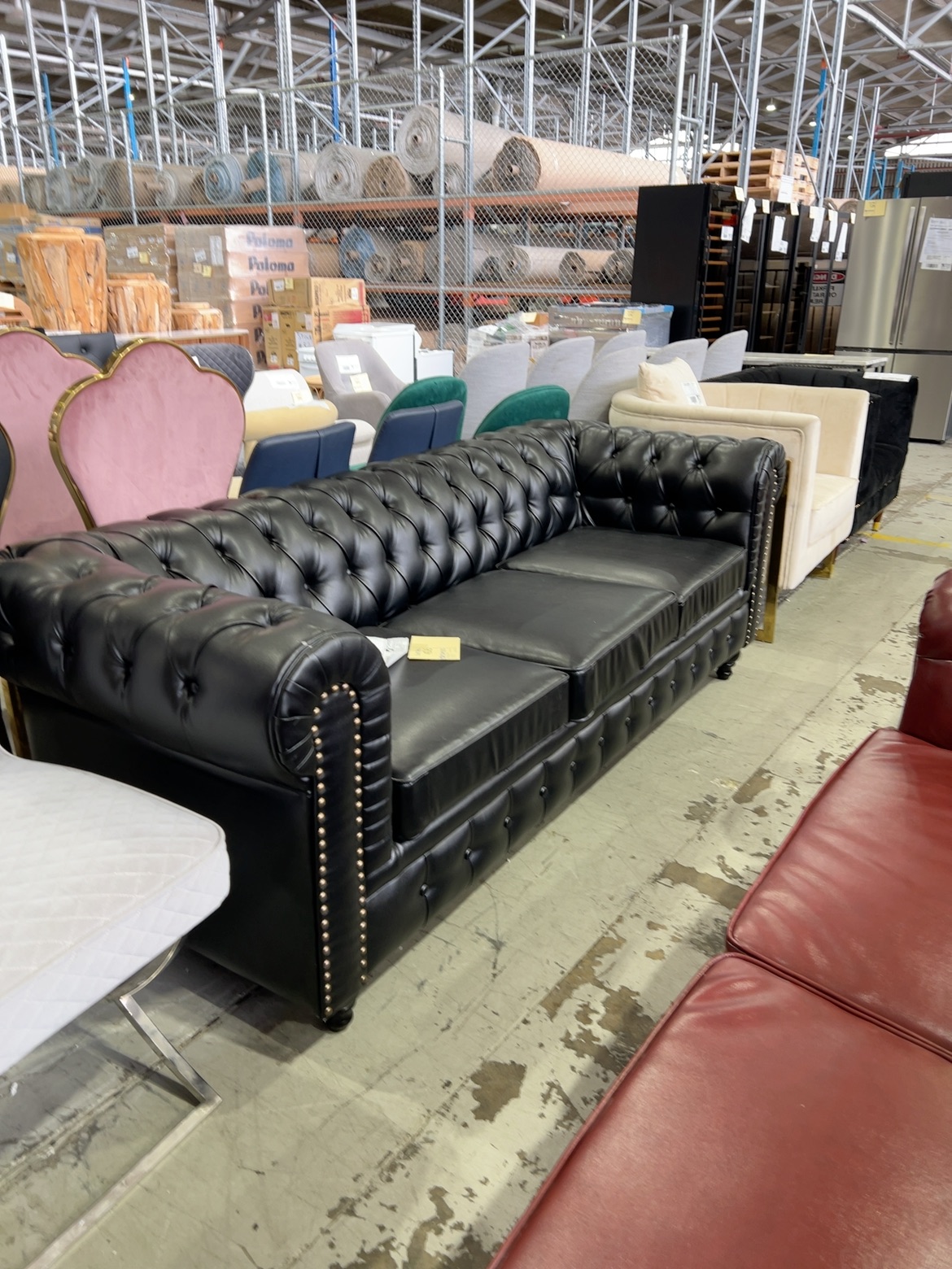 EX SHOWROOM - NESTER 3 SEATER CHESTERFIELD SOFA, BLACK BONDED LEATHER, 2250MM LONG, SOLD AS IS EX SHOWROOM - NESTER 3 SEATER CHESTERFIELD SOFA, BLACK BONDED LEATHER, 2250MM LONG, SOLD AS IS