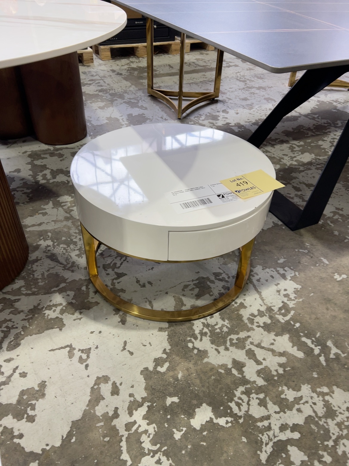 EX SHOWROOM - ROUND WHITE SIDE TABLE ON GOLD FRAME, SOME SMALL DAMAGE, SOLD AS IS EX SHOWROOM - ROUND WHITE SIDE TABLE ON GOLD FRAME, SOME SMALL DAMAGE, SOLD AS IS