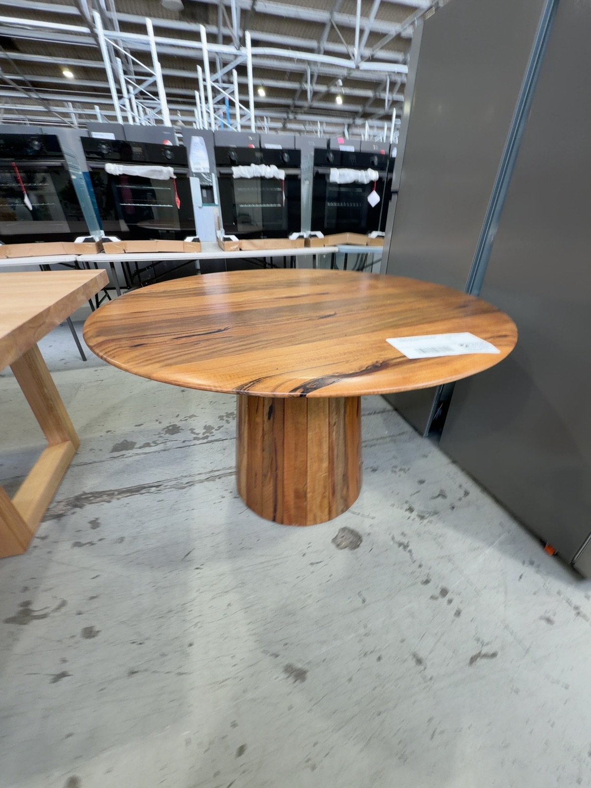 EX DISPLAY JINDALEE MARRI TIMBER ROUND 1200MM DINING TABLE, TAPERED CENTRAL PEDESTAL, SOLD AS IS EX DISPLAY JINDALEE MARRI TIMBER ROUND 1200MM DINING TABLE, TAPERED CENTRAL PEDESTAL, SOLD AS IS