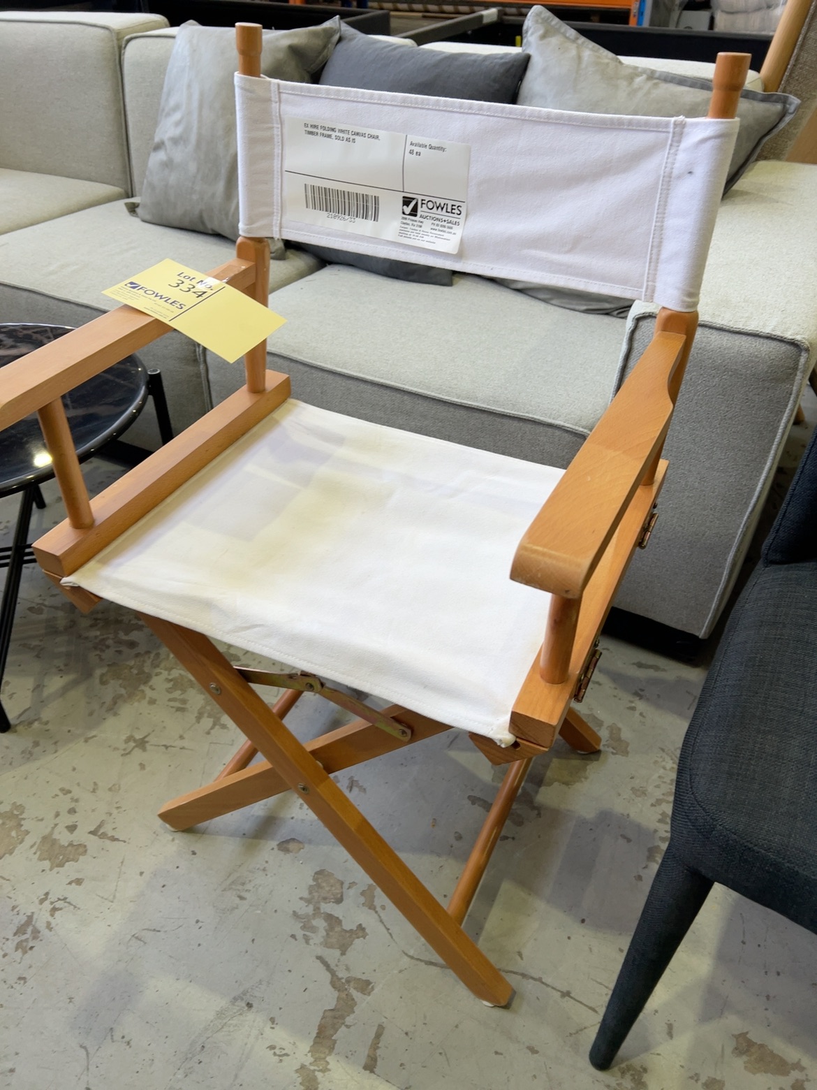 EX HIRE FOLDING WHITE CANVAS CHAIR, TIMBER FRAME, SOLD AS IS EX HIRE FOLDING WHITE CANVAS CHAIR, TIMBER FRAME, SOLD AS IS