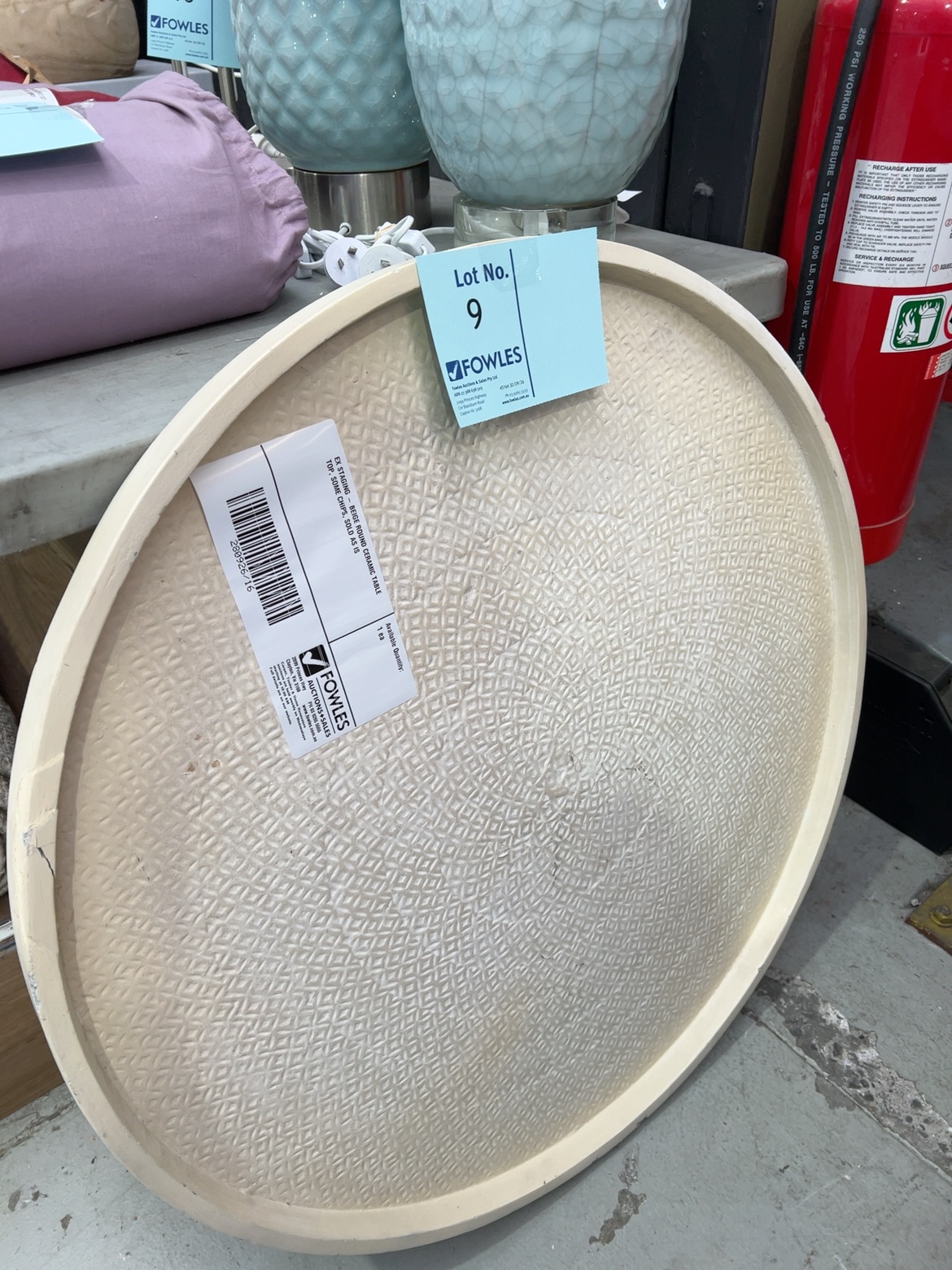 EX STAGING - BEIGE ROUND CERAMIC TABLE TOP, SOME CHIPS, SOLD AS IS EX STAGING - BEIGE ROUND CERAMIC TABLE TOP, SOME CHIPS, SOLD AS IS