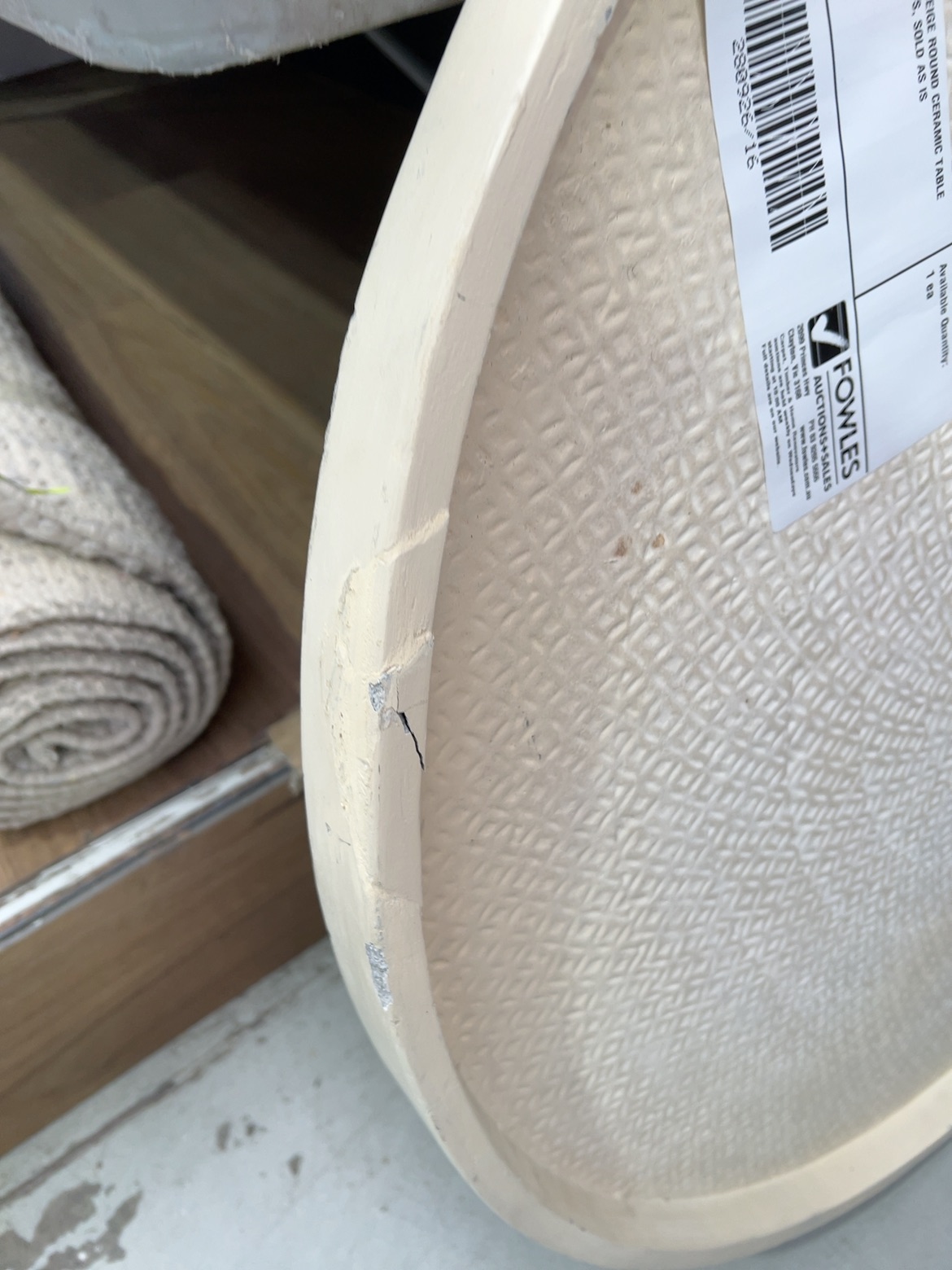 EX STAGING - BEIGE ROUND CERAMIC TABLE TOP, SOME CHIPS, SOLD AS IS EX STAGING - BEIGE ROUND CERAMIC TABLE TOP, SOME CHIPS, SOLD AS IS