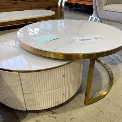 EX-SHOWROOM MILANO ROUND COFFEE TABLE WITH SLEEK STORAGE BASE, SOLD AS IS EX-SHOWROOM MILANO ROUND COFFEE TABLE WITH SLEEK STORAGE BASE, SOLD AS IS