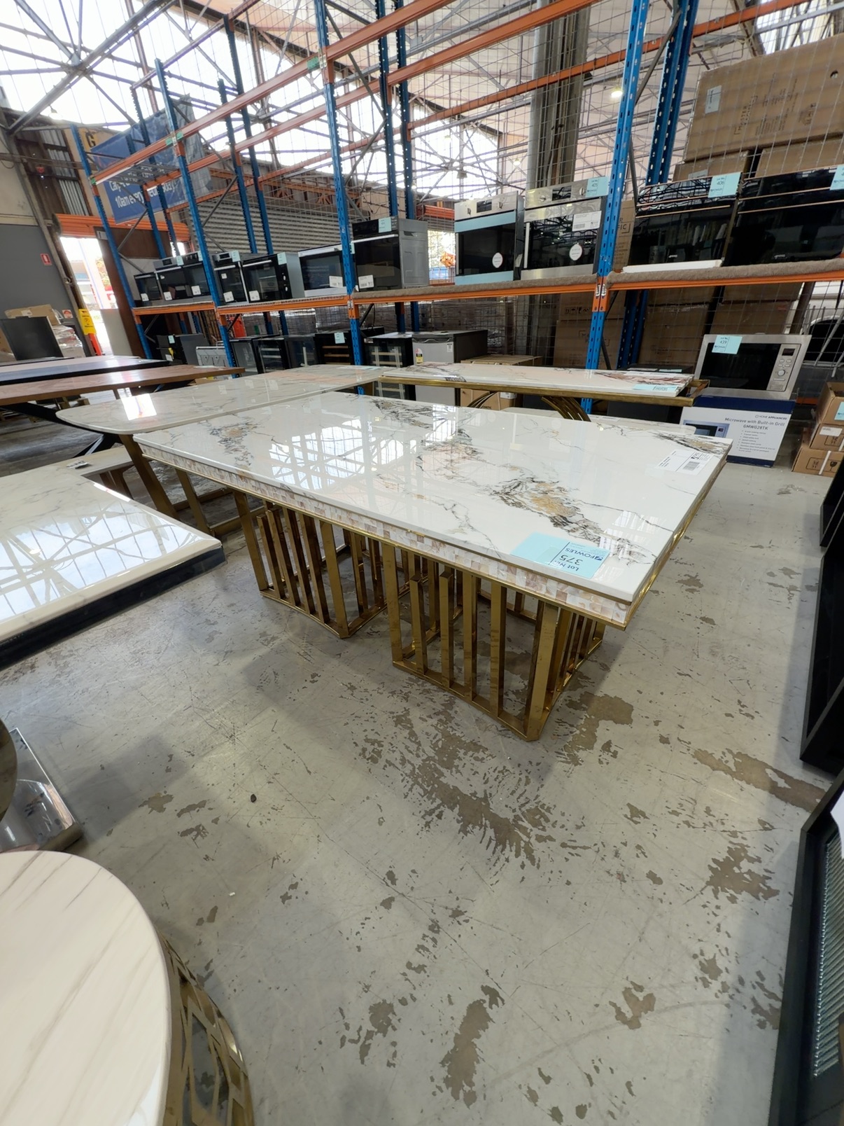 EX SHOWROOM - 1800MM MARBLE DINING TABLE WITH SHELL TRIM, AND GOLD STATEMENT BASE EX SHOWROOM - 1800MM MARBLE DINING TABLE WITH SHELL TRIM, AND GOLD STATEMENT BASE