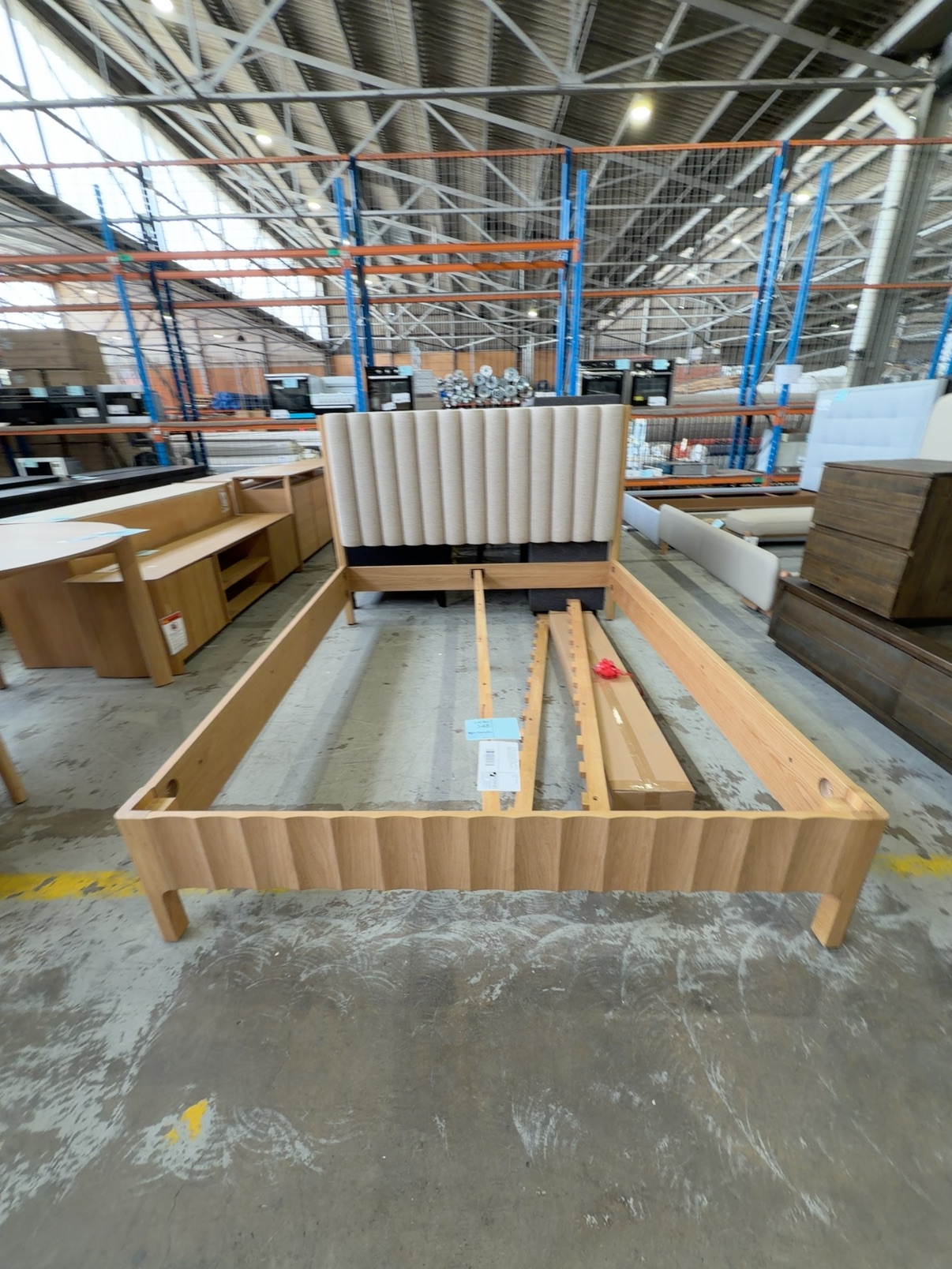 NEW BOND QUEEN SIZE BEDFRAME, AMERICAN OAK, WITH NATURAL PLUSH FLUTED UPHOLSTERED HEADBOARD AND SCALLOPED TIMBER BED BASE SOLD AS IS NEW BOND QUEEN SIZE BEDFRAME, AMERICAN OAK, WITH NATURAL PLUSH FLUTED UPHOLSTERED HEADBOARD AND SCALLOPED TIMBER BED BASE SOLD AS IS