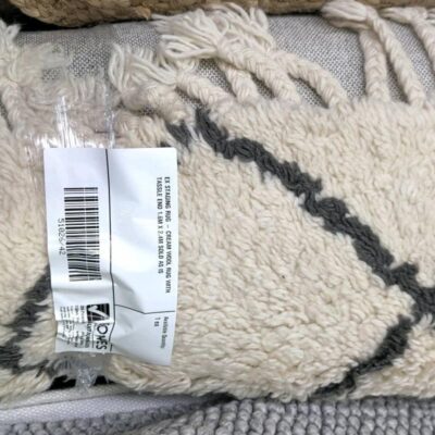 EX STAGING RUG - CREAM WOOL RUG WITH TASSLE END 1.6M X 2.4M SOLD AS IS EX STAGING RUG - CREAM WOOL RUG WITH TASSLE END 1.6M X 2.4M SOLD AS IS