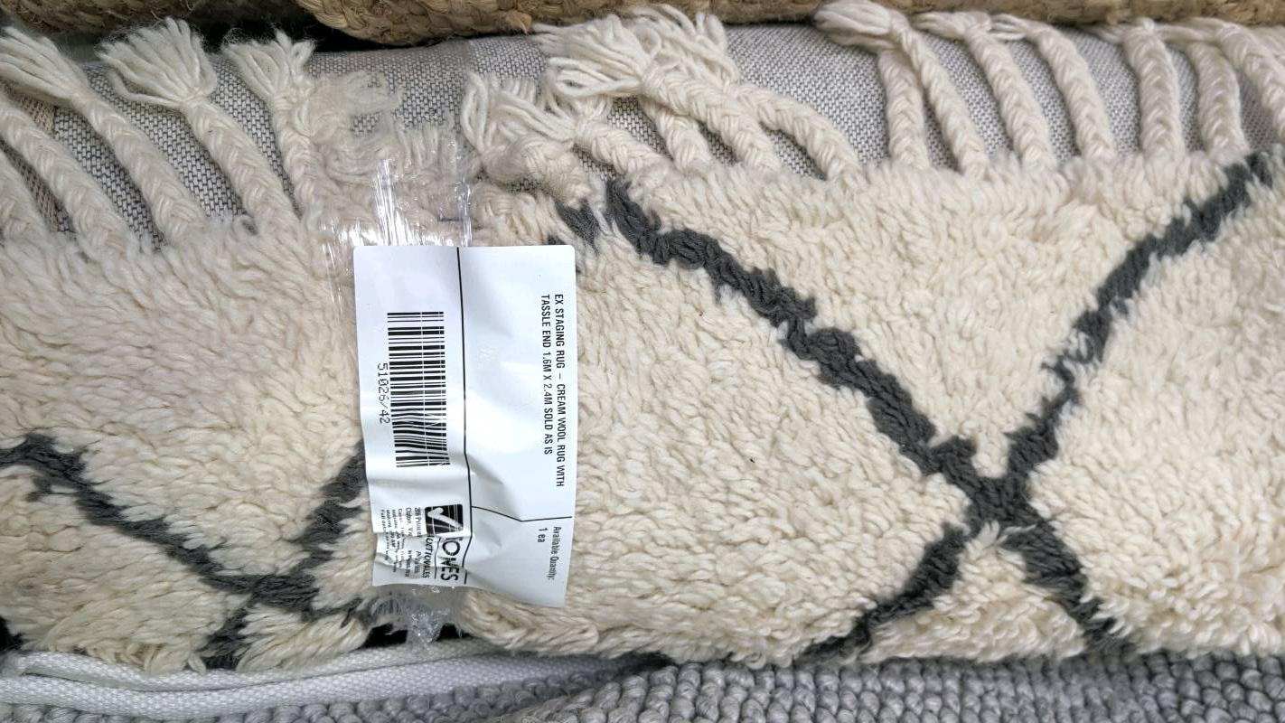 EX STAGING RUG - CREAM WOOL RUG WITH TASSLE END 1.6M X 2.4M SOLD AS IS EX STAGING RUG - CREAM WOOL RUG WITH TASSLE END 1.6M X 2.4M SOLD AS IS